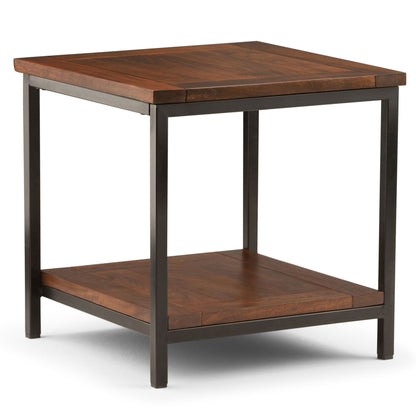 The Skyler - Handcrafted Table is a square wooden side table with a dark metal frame, a smooth flat top, and a lower shelf for extra storage.
