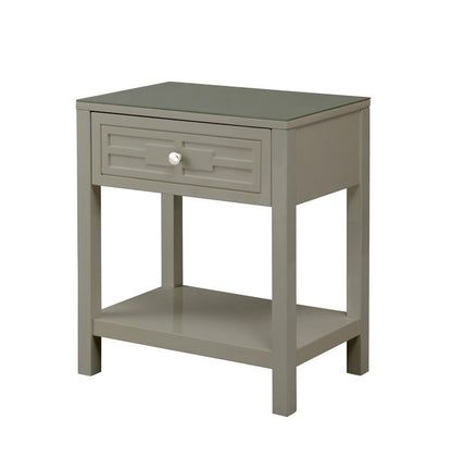 The Dylan Wooden End Side Table Nightstand features a glass top, a single drawer with a round white knob, and an open lower shelf, all in gray wood, shown against a plain white background.