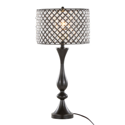 The Topaz - Contemporary Table Lamp features a black base and a decorative lattice-patterned metal and crystal lampshade, illuminated and displayed against a plain white background.