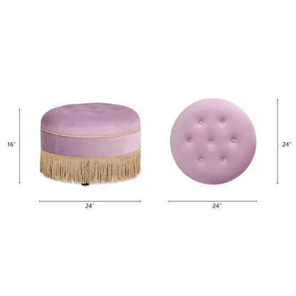 The Yolanda Round Upholstered Accent Ottoman in pink features tufted buttons on top, gold fringe at the base, and measures 16" tall by 24" wide. Shown from the side and top.