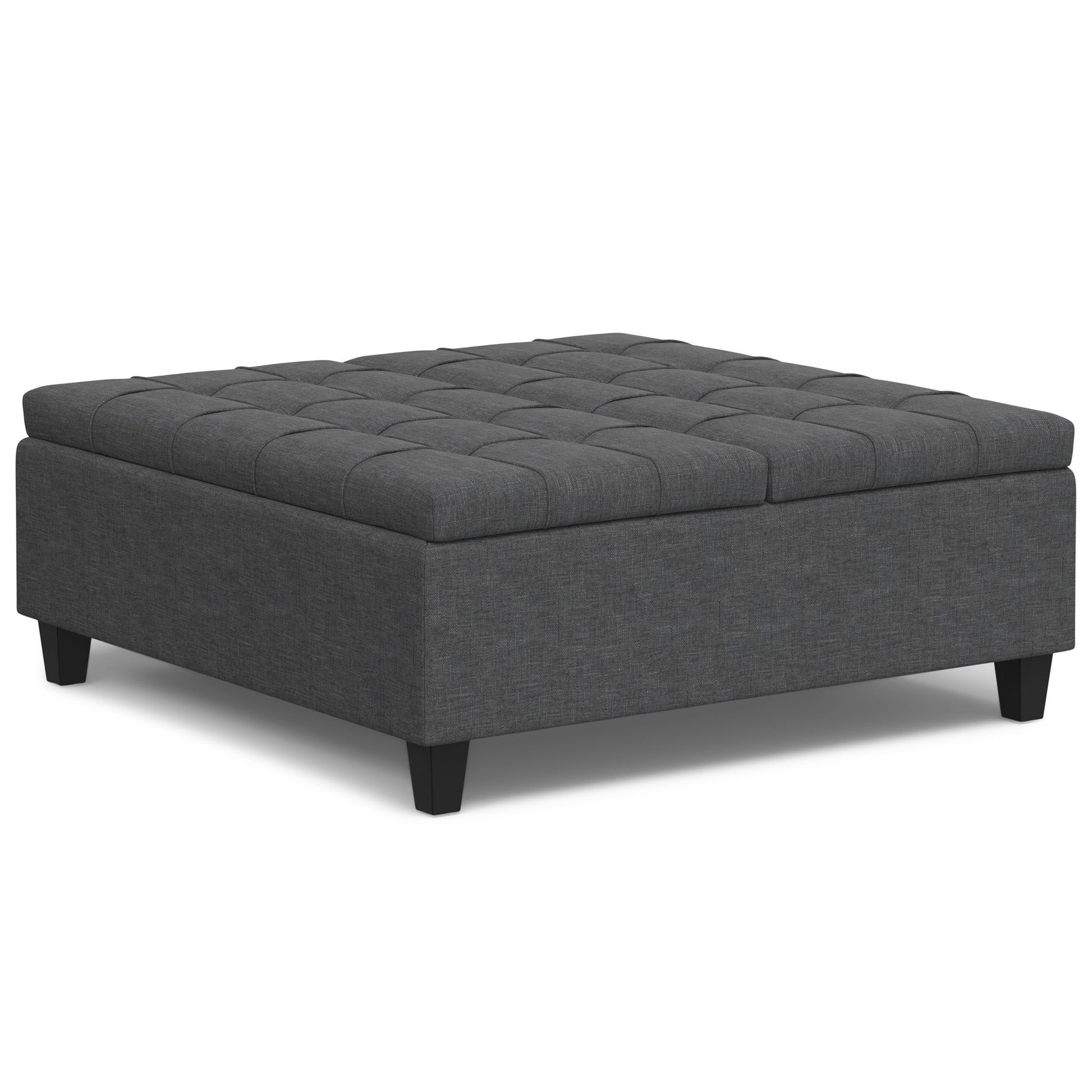 The Harrison Upholstered Coffee Table Storage Ottoman features a square, dark gray design with a tufted top and short black legs, shown against a white background.