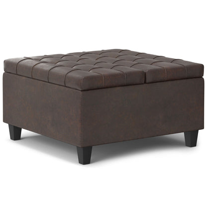 The Harrison Upholstered Coffee Table Storage Ottoman features a square, dark brown leather design with tufted top and short black legs, shown against a white background.