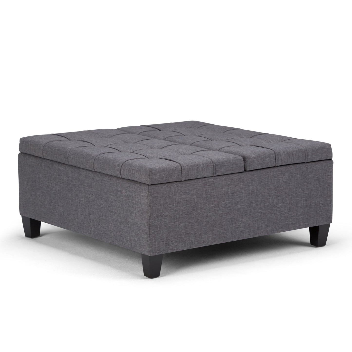 The Harrison Upholstered Coffee Table Storage Ottoman features a square design in dark gray fabric with tufted top details and short black legs, shown against a plain white background.