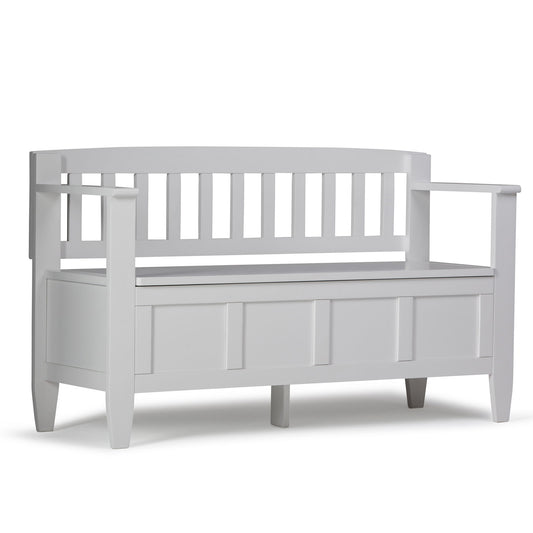 The Brooklyn Handcrafted Entryway Storage Bench features a white wooden design with a slatted backrest, armrests, and a storage compartment under the seat.