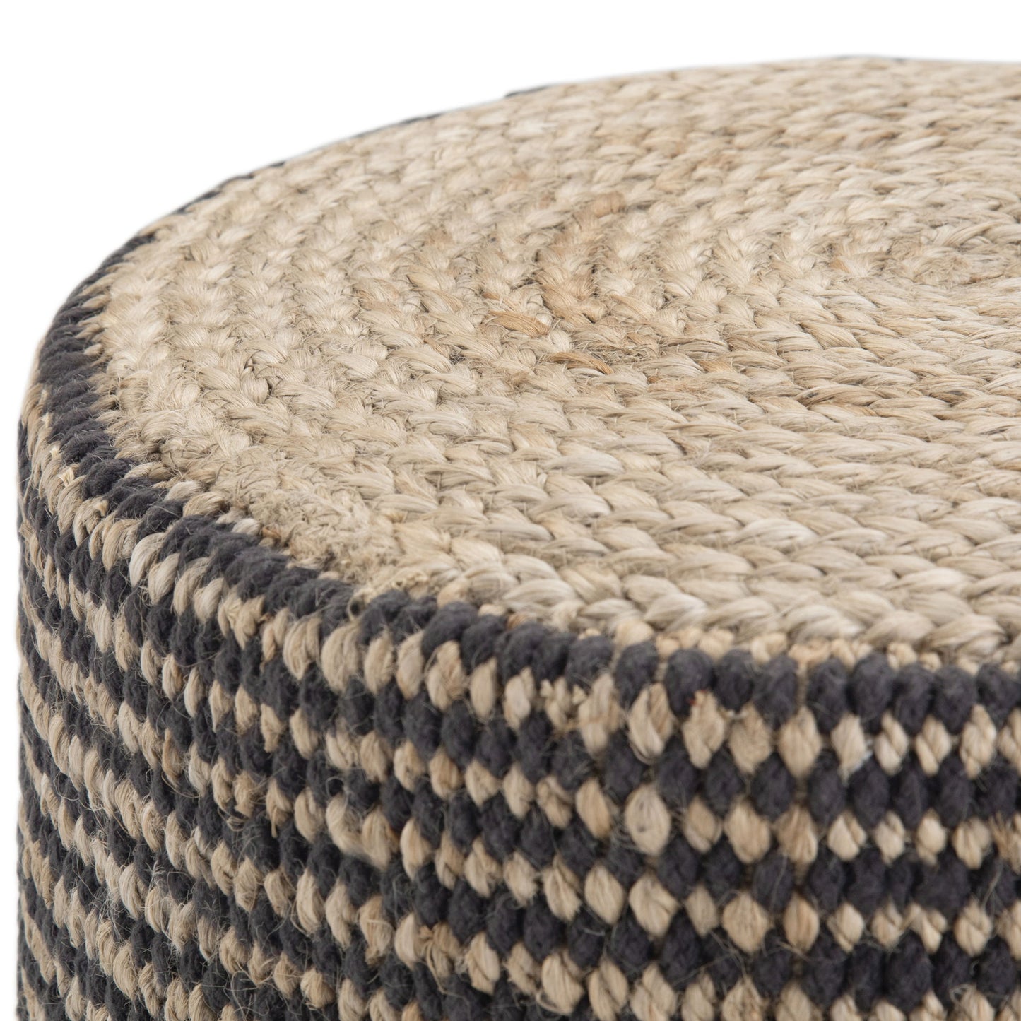 Close-up of the Larissa - Handcrafted Round Braided Pouf, featuring a coiled top and black and natural checkered sides, crafted from woven jute.
