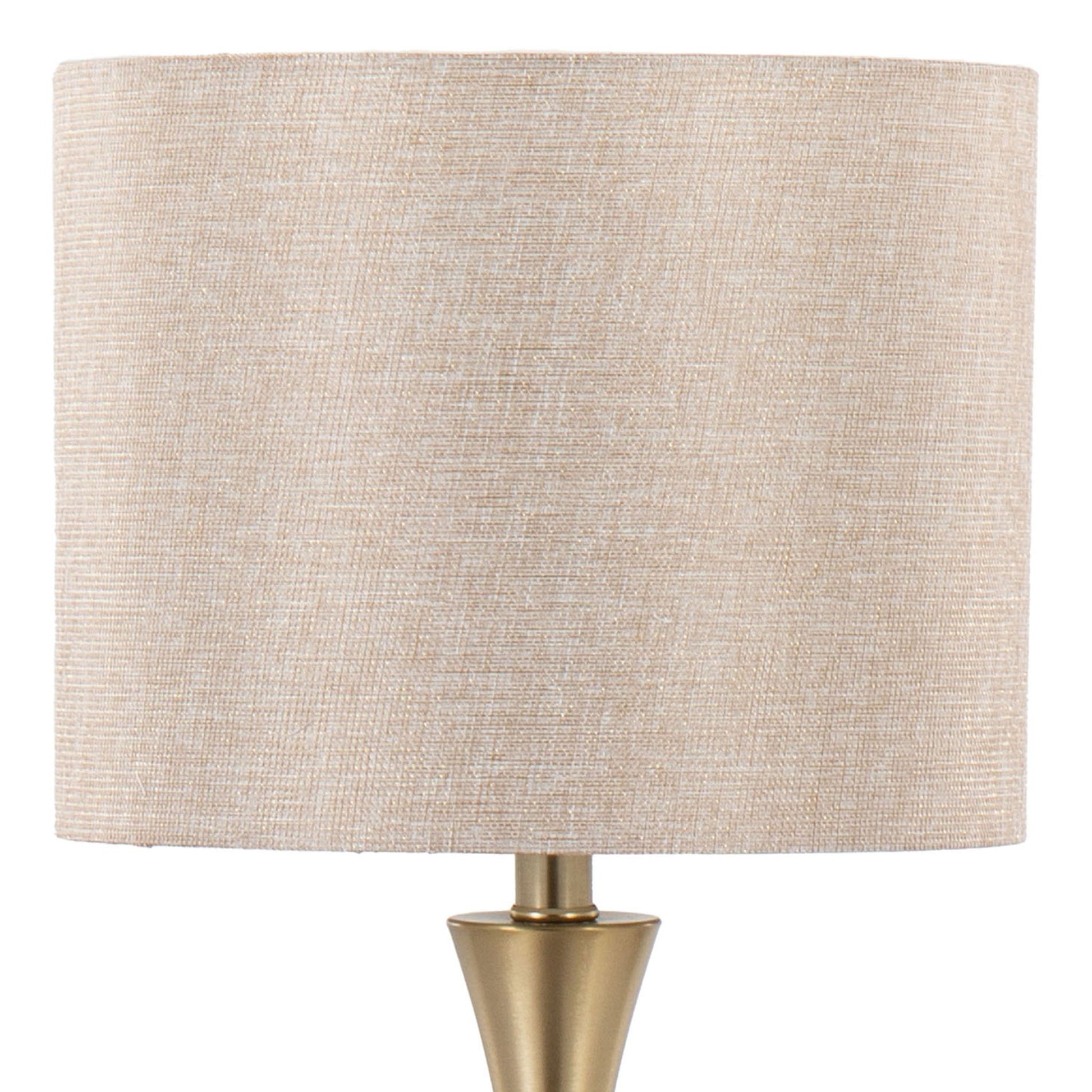 A close-up of the Lenuxe Contemporary & Modern Design Table Lamp (Set of 2) featuring a beige fabric lampshade and brass base, photographed against a white background.
