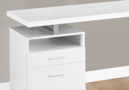 A close-up of the Computer Desk For Home Office featuring a floating tabletop, open shelf, and two drawers with silver handles. The contemporary white desk stands on a light wood floor with a light gray-beige wall behind it.