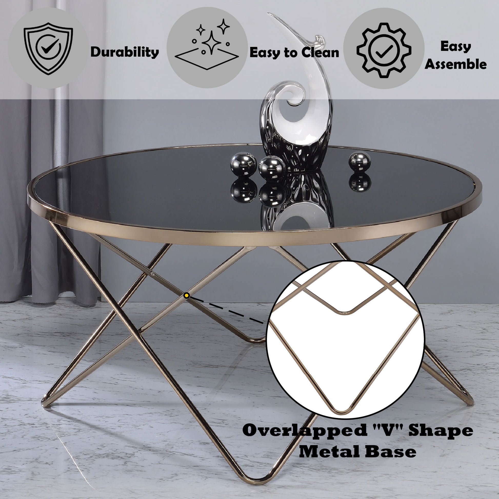 The Valora - Glass Coffee Table features a round glass top and a striking metallic gold base with overlapping "V" shapes. Comes with decorative sculpture and orbs, and icons for durability, easy cleaning, and simple assembly.