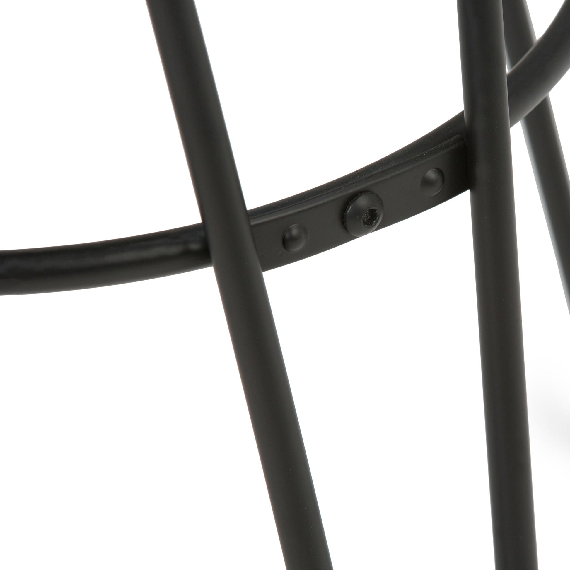 Close-up of intersecting black metal rods with a riveted joint, part of the Simeon Multifunctional Metal Stool With Wood Seat, shown against a white background.