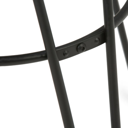 Close-up of intersecting black metal rods with a riveted joint, part of the Simeon Multifunctional Metal Stool With Wood Seat, shown against a white background.