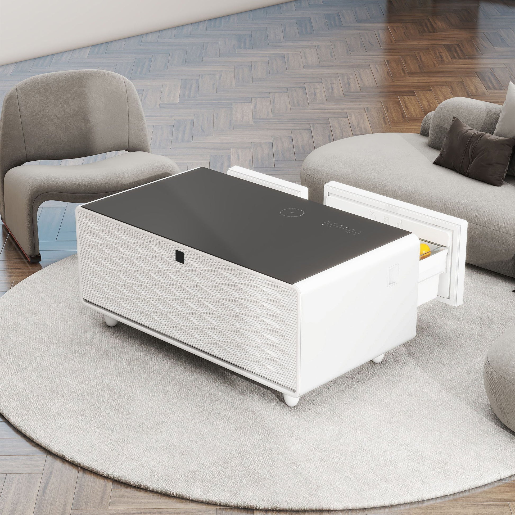 A Modern Smart Coffee Table With Built-In Fridge, Bluetooth speaker, wireless charging, and touch control panel sits on a round rug between a gray armchair and a curved sectional sofa atop a wooden floor.