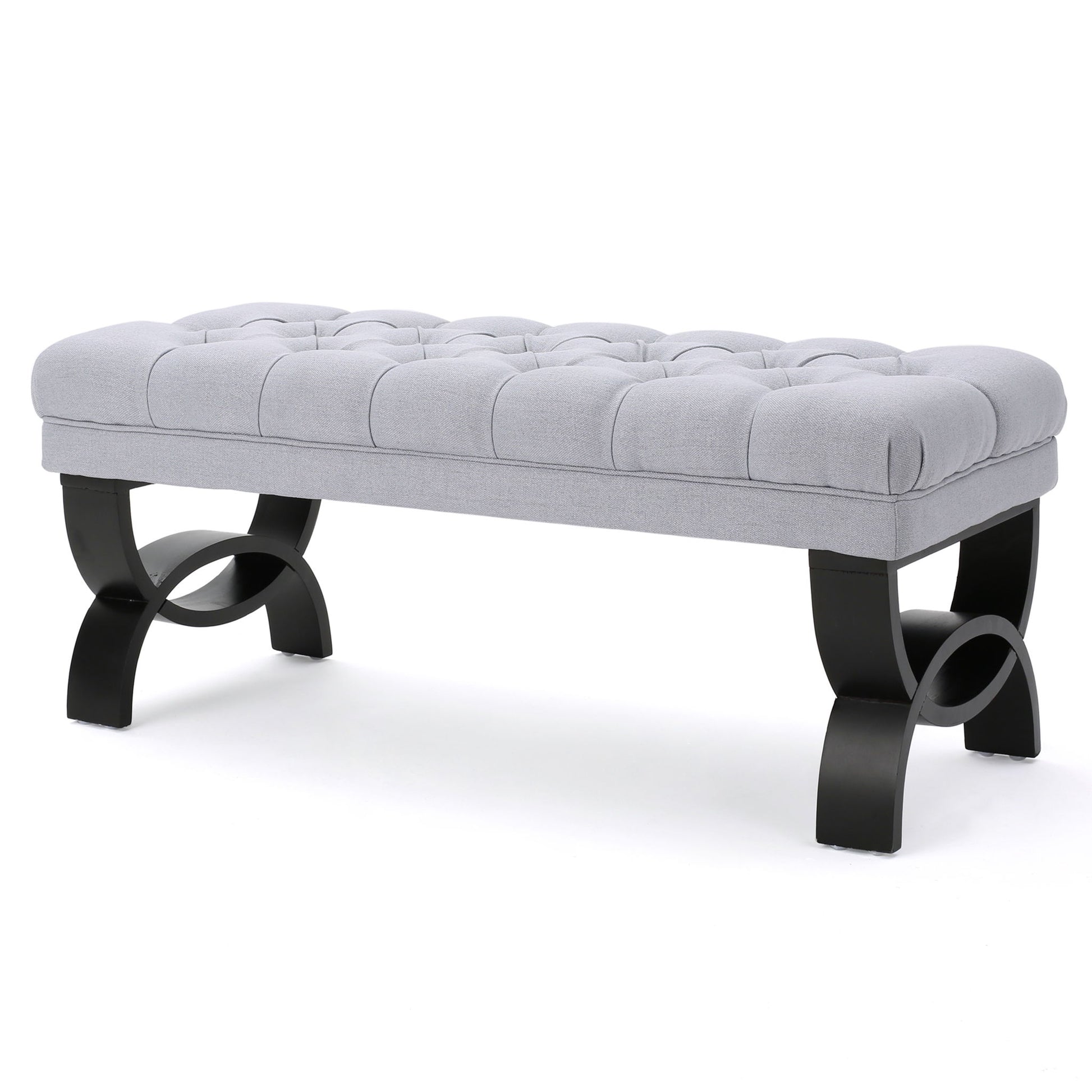 The Hilton - Ottoman Bench Classic Style features a tufted light gray upholstered cushion and curved black wooden legs, shown against a white background.