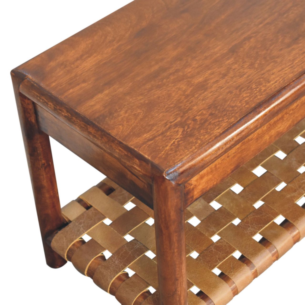 Close-up of the Regency Woven Bench in Brown, featuring a rectangular wooden top and a lower shelf crafted from interwoven leather straps, shown at an angle to highlight its corner and craftsmanship.