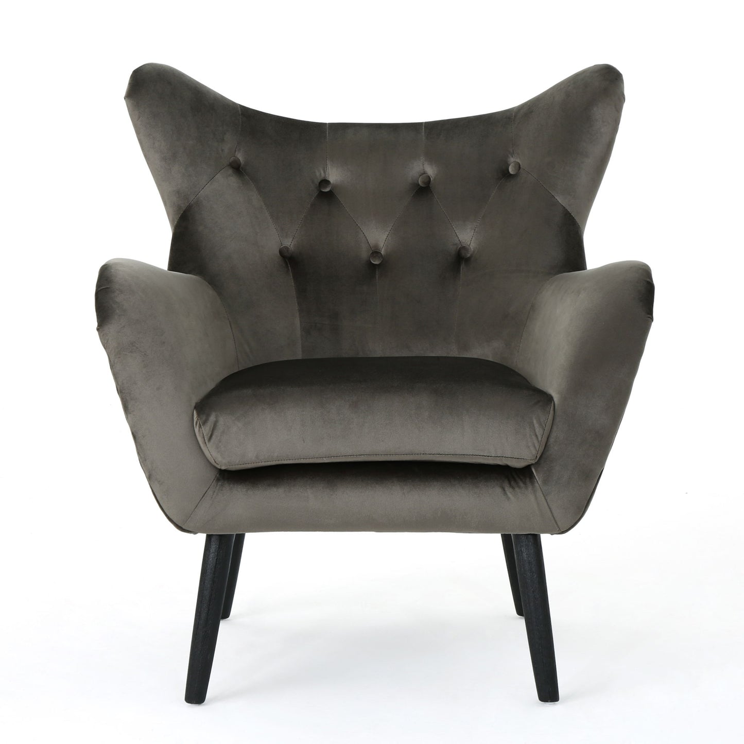 The Alyssa Mid Century Upholstered Arm Chair features a dark gray velvet finish, wingback design, button tufting, and angled black wooden legs, shown against a white background.