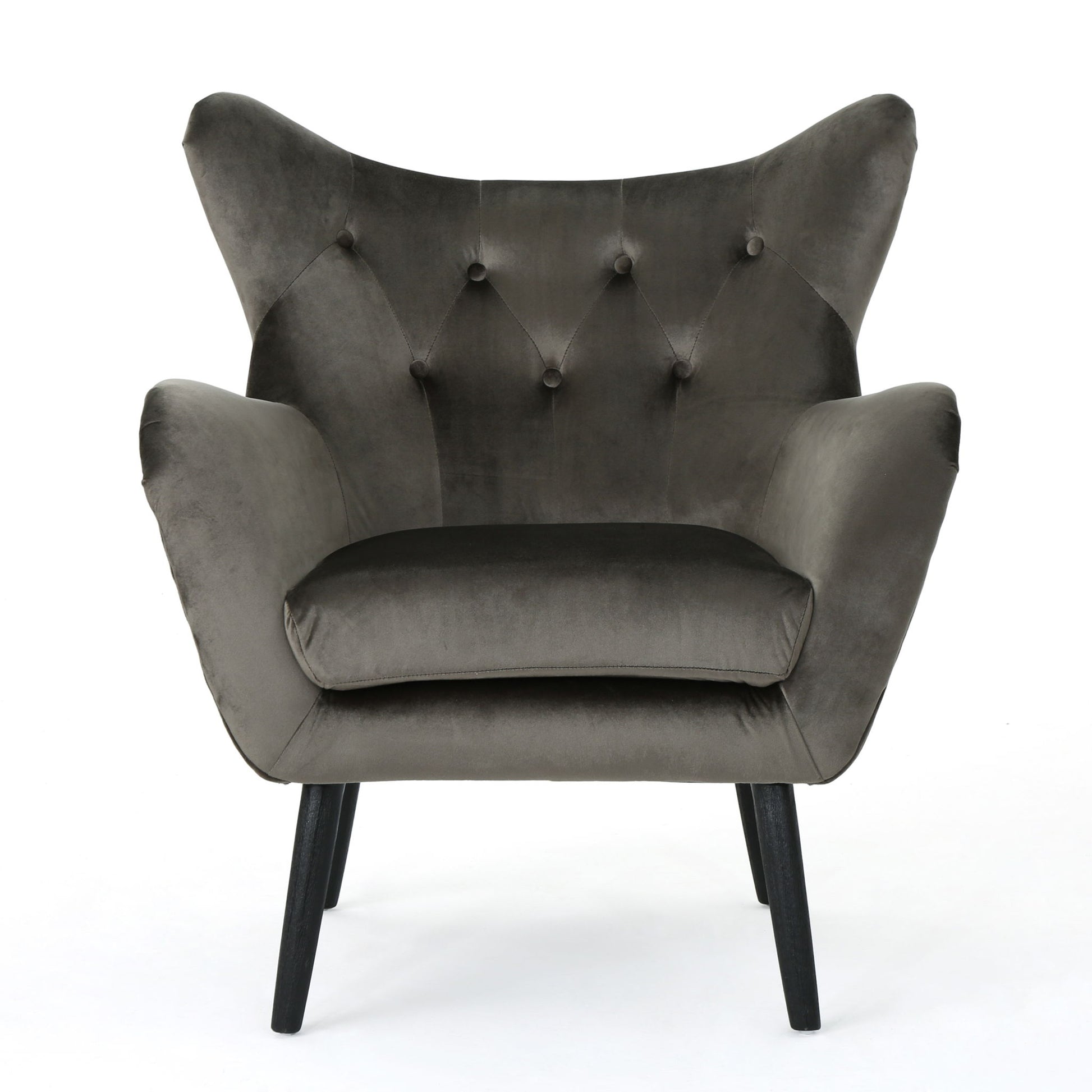 The Alyssa Mid Century Upholstered Arm Chair features a dark gray velvet finish, wingback design, button tufting, and angled black wooden legs, shown against a white background.