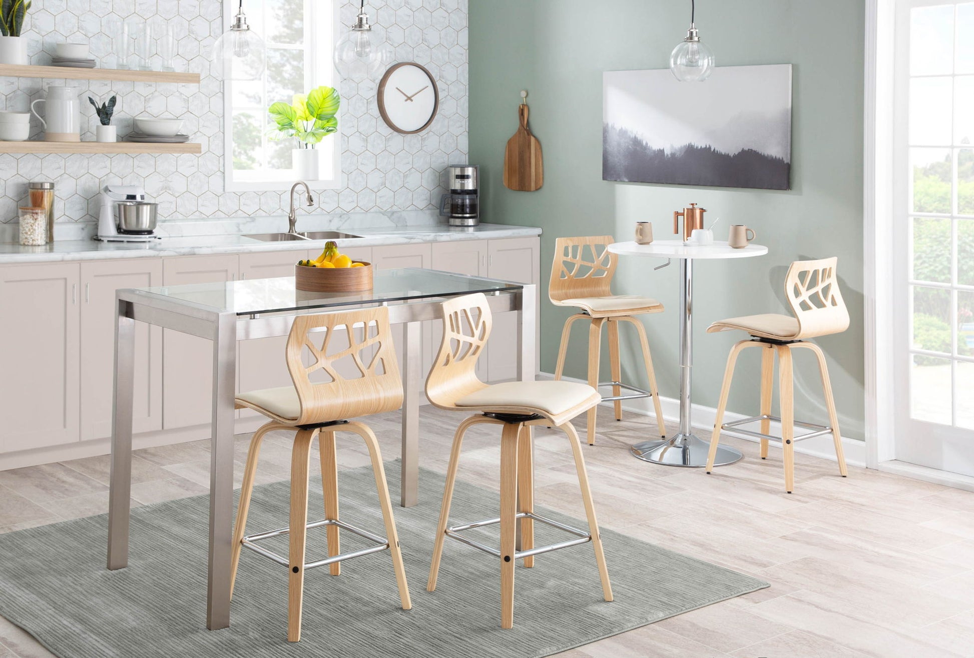 A modern kitchen featuring light cabinets, a metal dining set with wooden cut-out chairs, an Adjustable Contemporary Bar Table in white with two mugs on top, and large windows allowing natural light to fill the space.