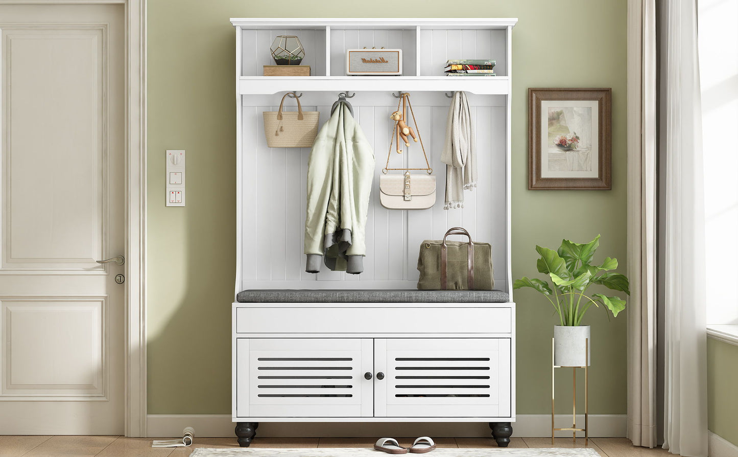 The 5 In 1 Entryway Bench features a cushioned seat, shutter-shaped doors, four sturdy coat hooks for jackets and bags, and hidden storage. Placed against a pale green wall with nearby decor, sunlight fills the welcoming hallway space.