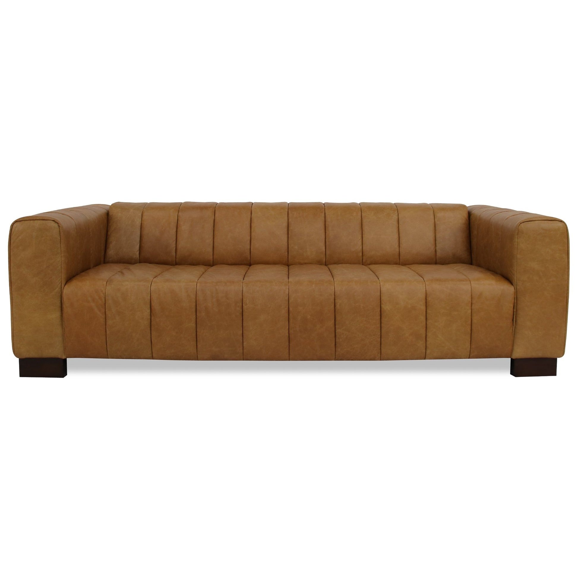 The Dixon - Waxy Sofa - Tan features a modern design with wide square arms, vertical tufted cushions, and dark wooden block legs, shown against a white background.