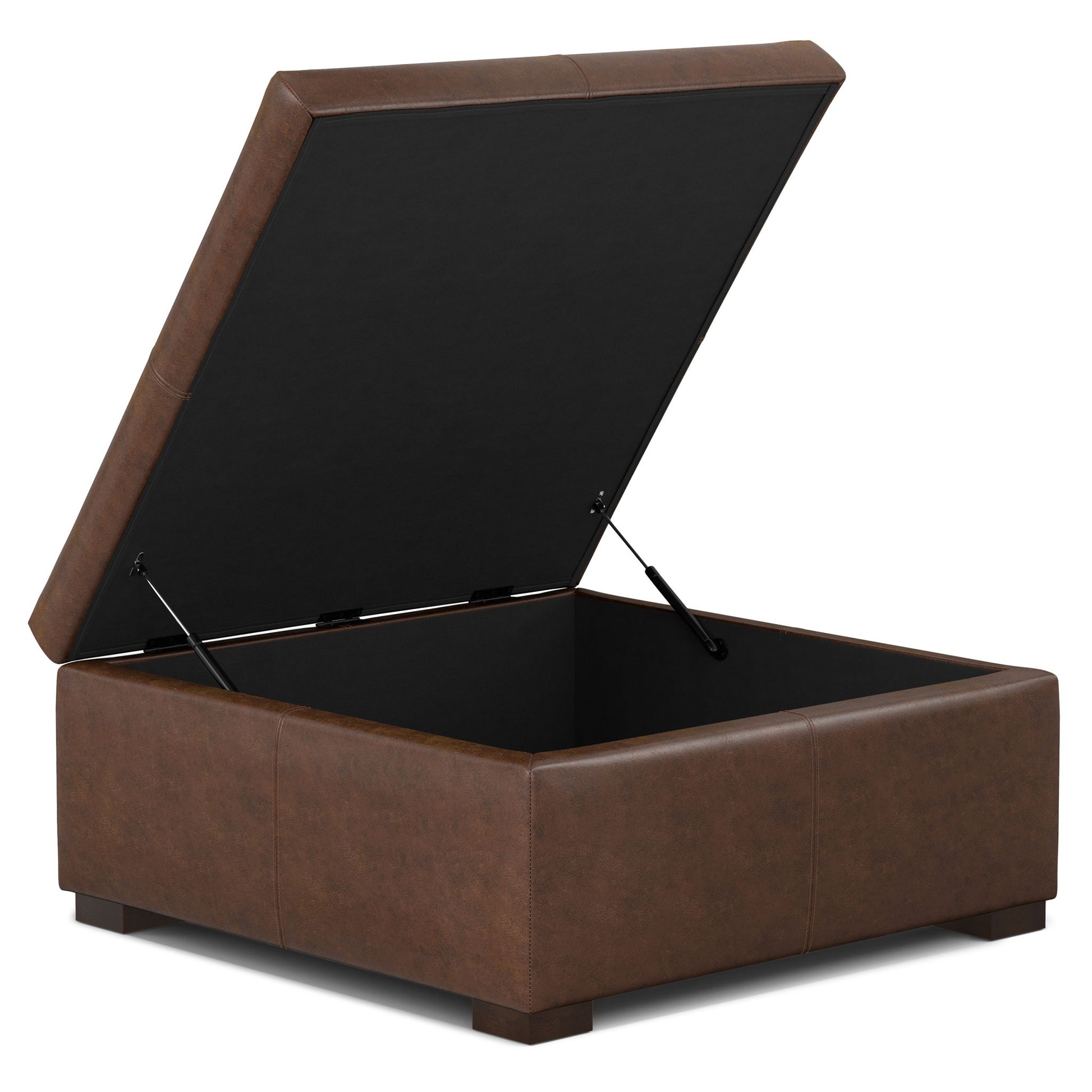 The Gabbie Coffee Table Upholstered Storage Ottoman is a brown, square leather piece with a hinged lid that opens to reveal storage space inside, resting on short, sturdy legs.