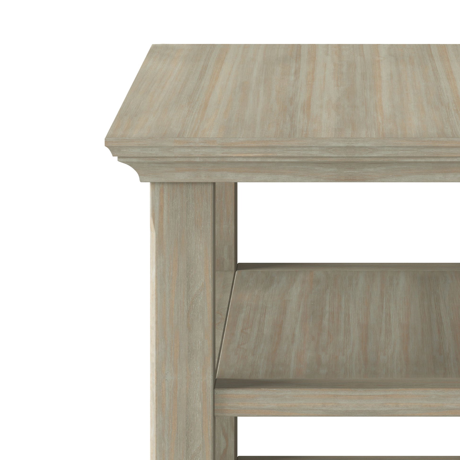 A close-up of the Acadian - Narrow Side Table, Handcrafted, in light wood with two lower shelves, sturdy rectangular legs, and a smooth finish, shown from the corner and partially cropped.
