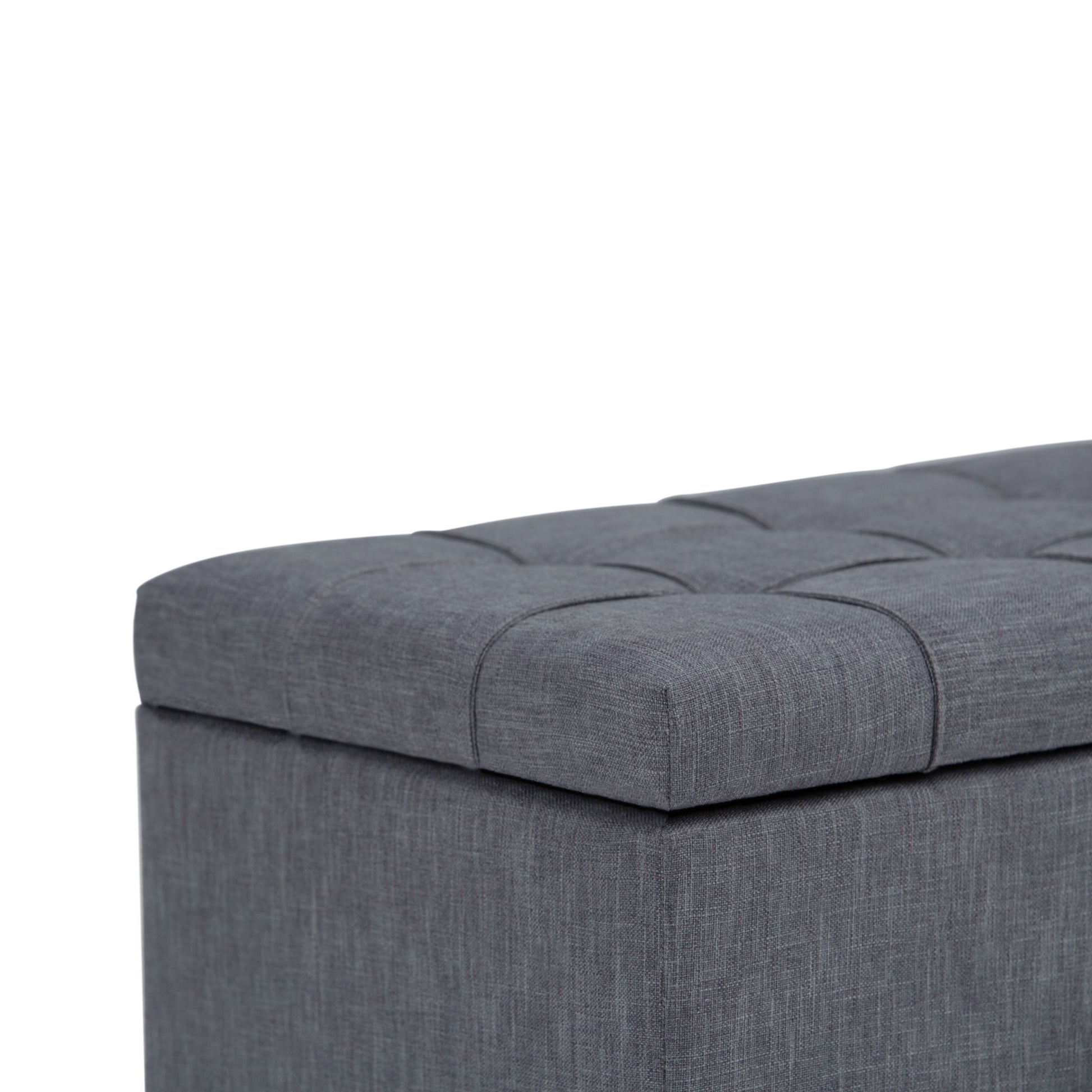 A close-up of the Sienna Upholstered Storage Ottoman Bench in gray, featuring a tufted, cushioned lid, set against a white background.