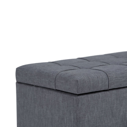 A close-up of the Sienna Upholstered Storage Ottoman Bench in gray, featuring a tufted, cushioned lid, set against a white background.