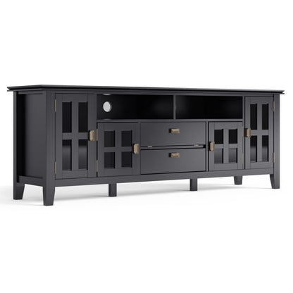 The Artisan TV Media Stand features a modern black finish, two glass-paneled side cabinets, two center drawers, open upper shelves, and brass hardware—perfect for stylish media storage and entertainment setups.