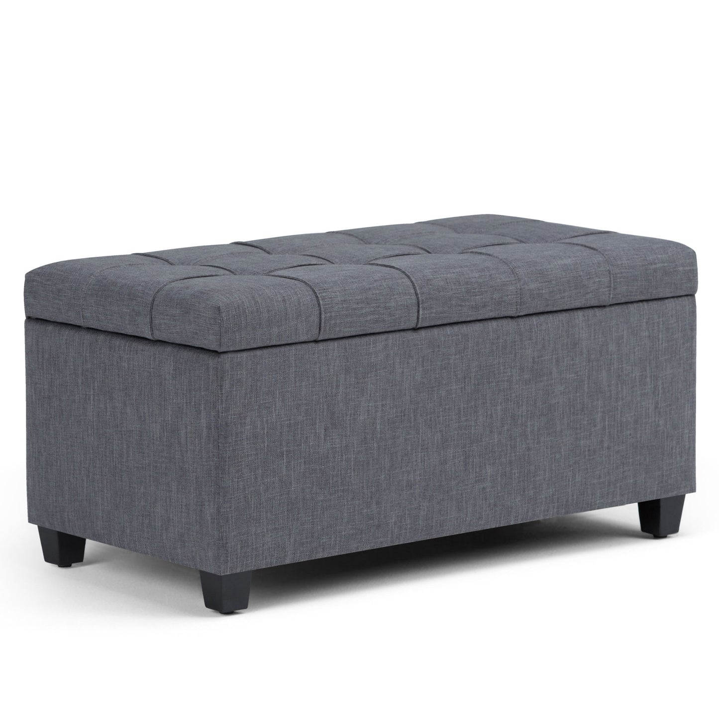 The Sienna Upholstered Storage Ottoman Bench is a rectangular, gray bench with a tufted lid and short black legs, shown on a white background.