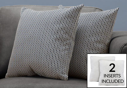 Two decorative square throw pillows with black and white geometric patterns are on a gray couch. An inset displays two plain white hypoallergenic inserts, with text: "2 inserts included.