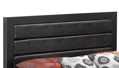 A close-up of the Transitional Modern Design Bed’s black padded headboard with horizontal paneling, partially showing a rust-colored blanket and pillows with black, white, and red floral patterns.