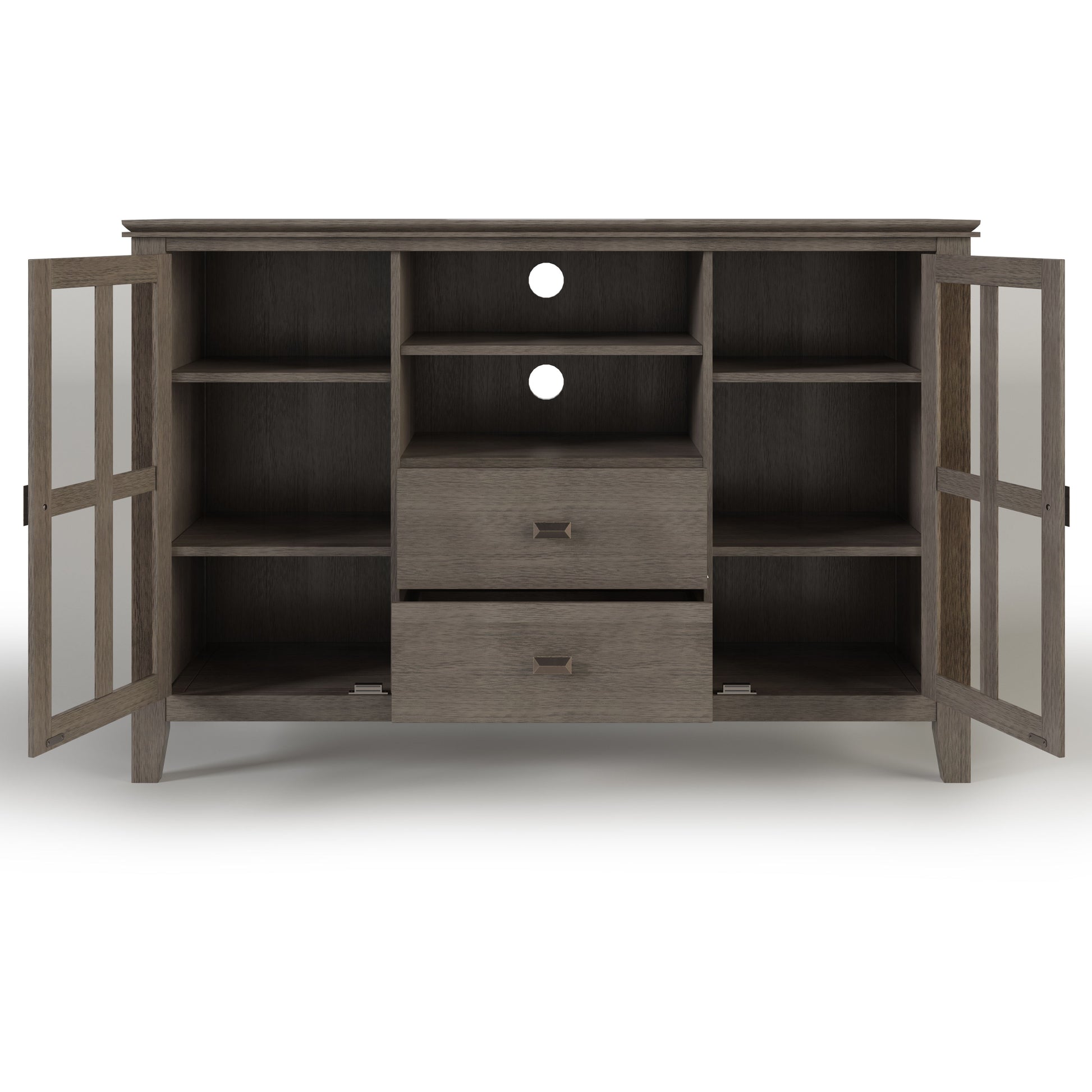 The Artisan Handcrafted Tall TV Media Stand features two glass-paneled doors, six shelves, two central drawers, and two circular cable cutouts on the back. Finished in medium brown wood grain.