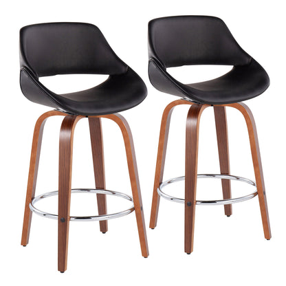 Set of 2 Fabrico Mid-Century Modern counter stools featuring black curved, low-back seats, wooden arched legs with metal braces, and a round chrome footrest for added support. Fixed height design.