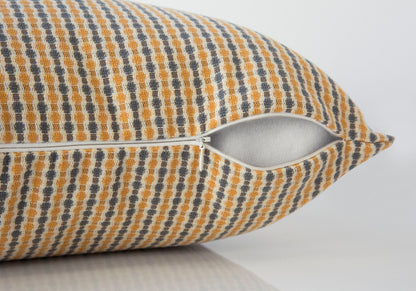 A close-up of a Square Decorative Throw Pillow with a yellow, gray, and white dotted pattern, showing the partially open white zipper and inner fabric. Hypoallergenic insert included.