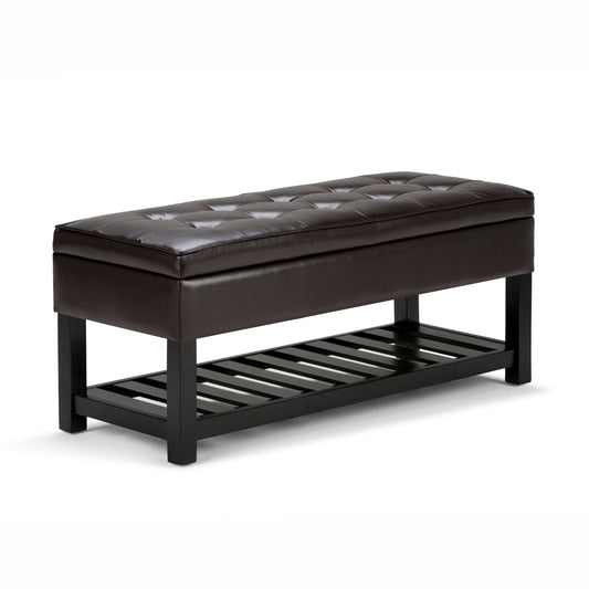 The Cosmopolitan Storage Ottoman Bench in Tanners Brown features a dark brown tufted leather cushion, black wooden legs, and an open slatted lower shelf for storage.