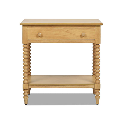 The Easton - Modern Farmhouse Turned 1 Drawer Storage Side Table With Shelf in Natural Brown features a single drawer with a round knob, an open lower shelf, and four turned spindle legs in a light natural wood finish.
