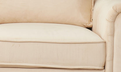 Close-up of the Graceful Design Plush Comfort Loveseat’s beige upholstered cushion with matching backrest and armrest, highlighting its soft fabric texture and plush padding.