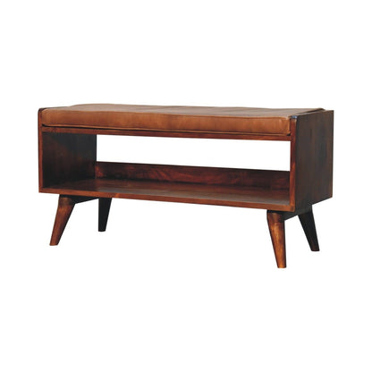 The Solid Wood Bench With Upholstered Seat features a minimalist mid-century modern design with angled legs, an open lower shelf, a tan cushioned seat, and a rich wood finish.