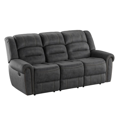 The Ferrar Reclining Sofa in gray is a three-seater with plush, padded cushions and nailhead trim on the armrests, featuring visible stitching and a modern, comfortable design.