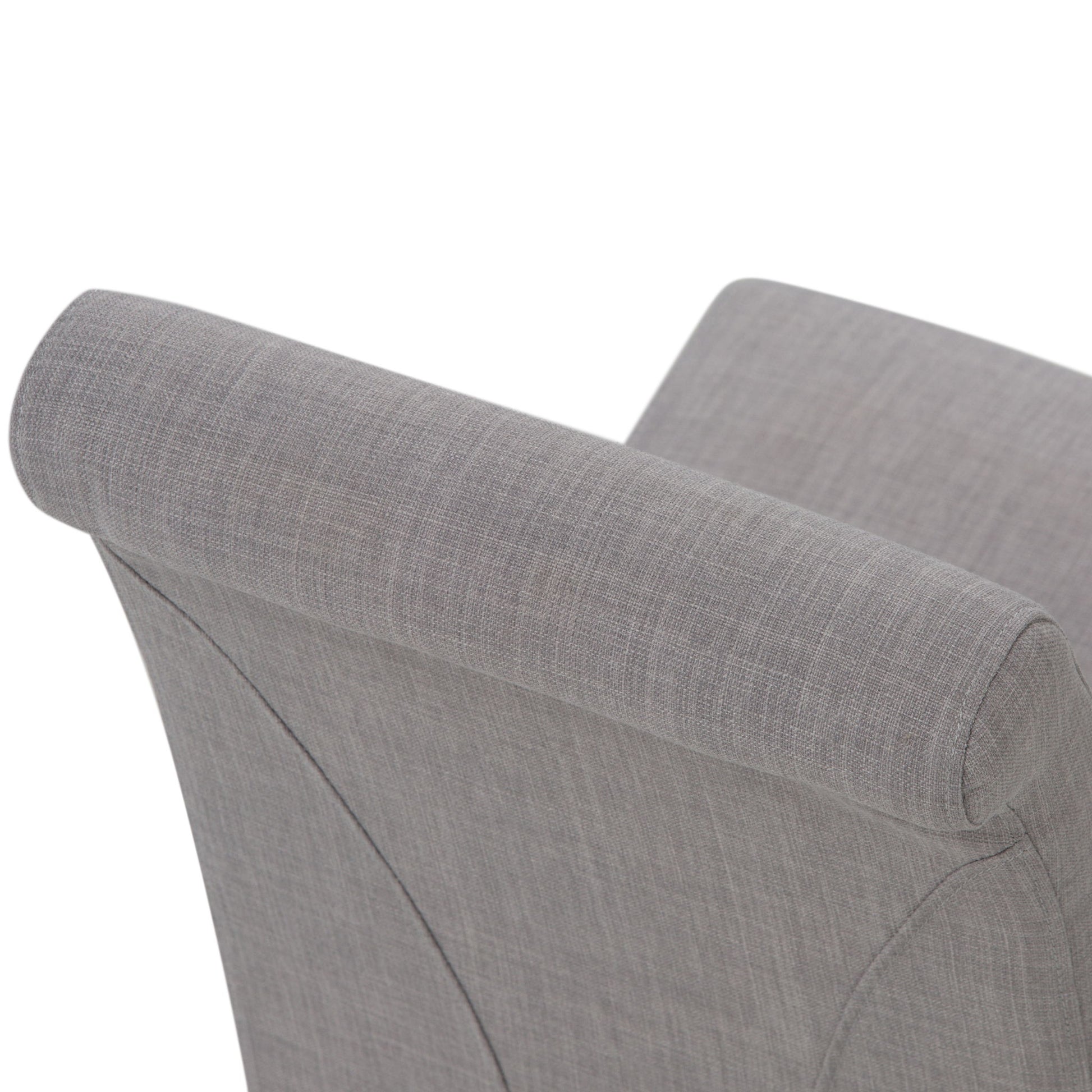 Close-up of the Avalon - Deluxe Parson Dining Chair (Set of 2) shows its gently curved headrest and upper back, upholstered in light gray fabric with smooth stitching for a modern look.