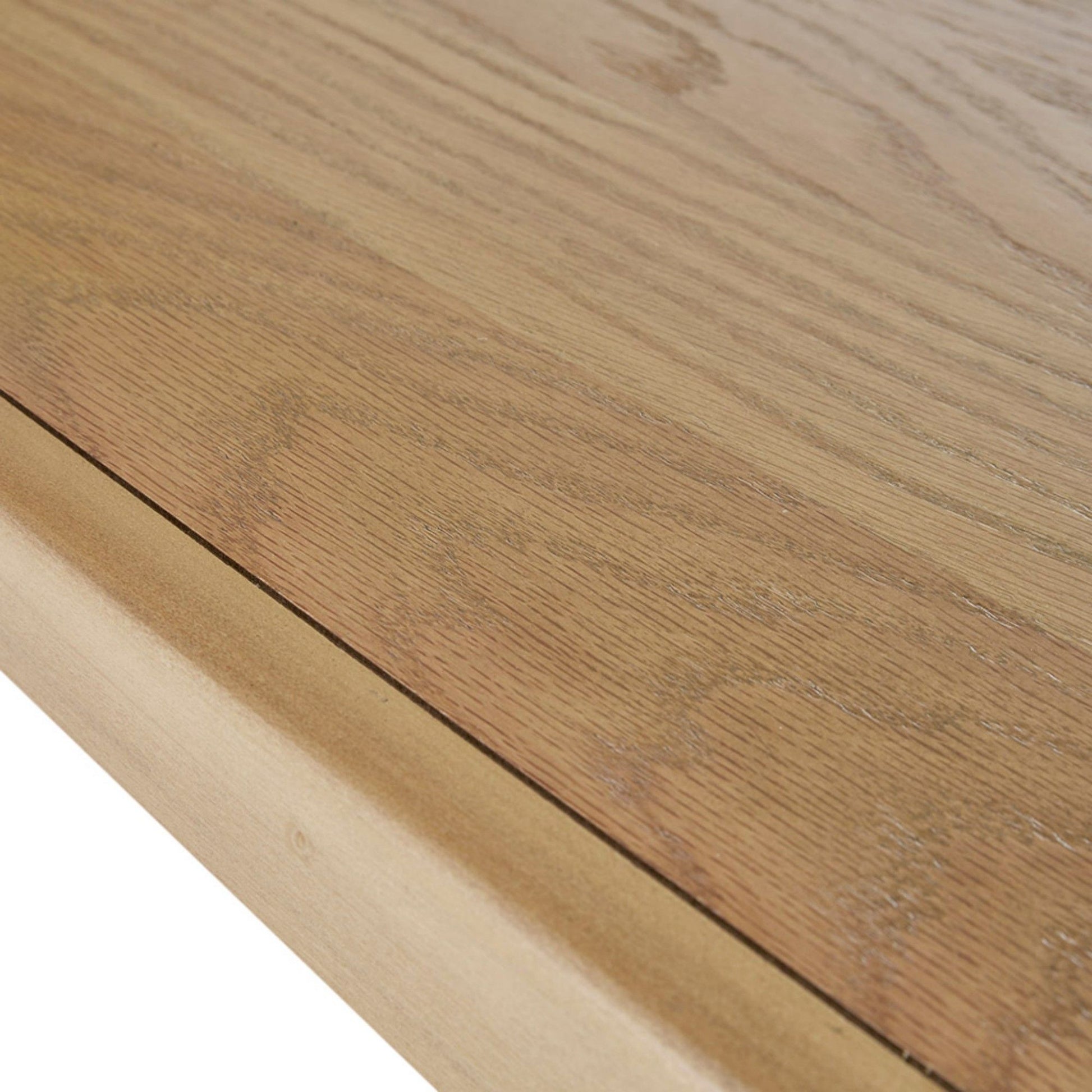 Close-up of the Modern Table With Extra Storage’s corner, highlighting the natural wood grain, smooth finish, beveled edge, and light brown color.