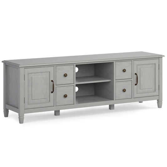 The Connaught Wide TV Stand features a light gray wooden finish, two cabinets, four drawers with round handles, and two open center shelves with cable management holes on the back.
