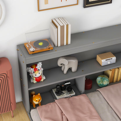 A Floor Bed With L-Shaped Bookcases (Sliding Doors, Without Slats) holds books, a toy turntable, a cartoon animal figure, a gray elephant sculpture, a small radio, camera, globe, and fox figurine. A pink blanket partially covers the bed.