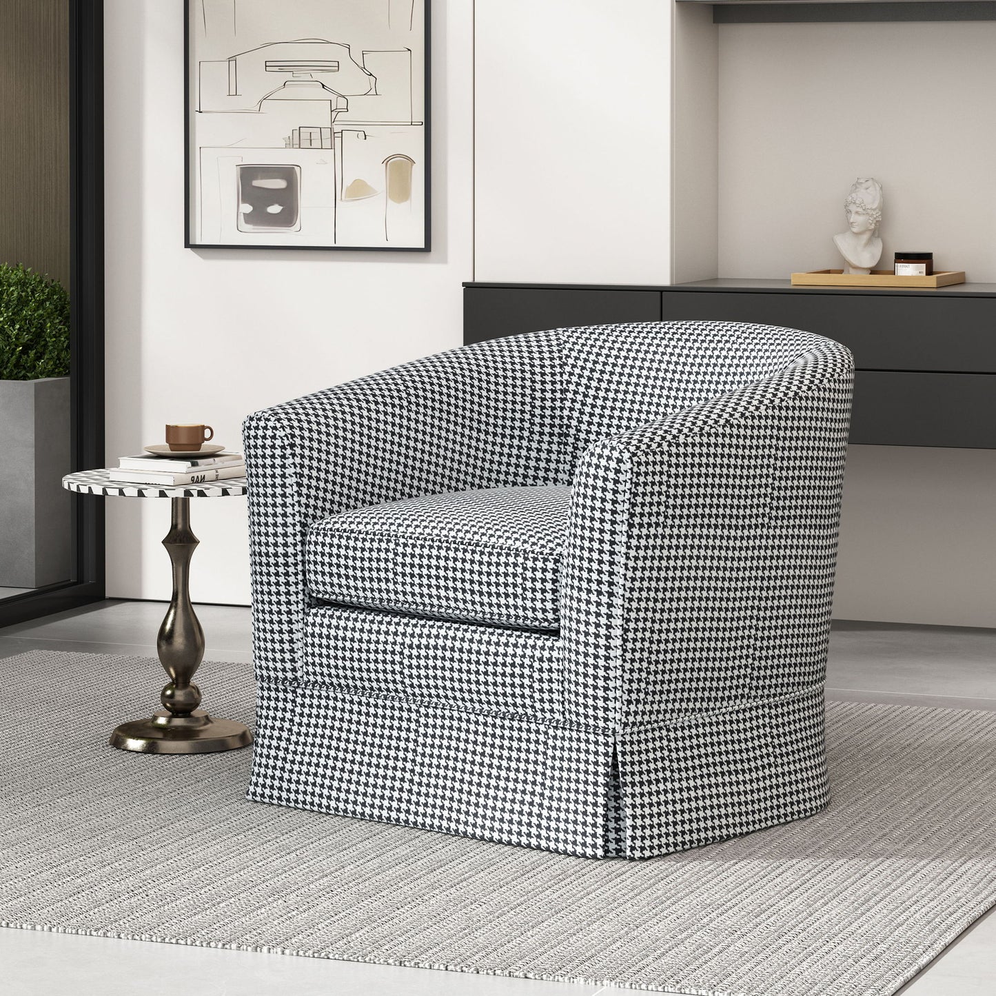 A modern living room featuring the Zeniqua Upholstered Velvet Swivel Chair with loose cover, a round side table with a coffee cup and saucer, minimalist decor, a gray rug, and wall art.