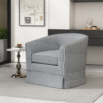 A modern living room featuring the Zeniqua Upholstered Velvet Swivel Chair with loose cover, a round side table with a coffee cup and saucer, minimalist decor, a gray rug, and wall art.