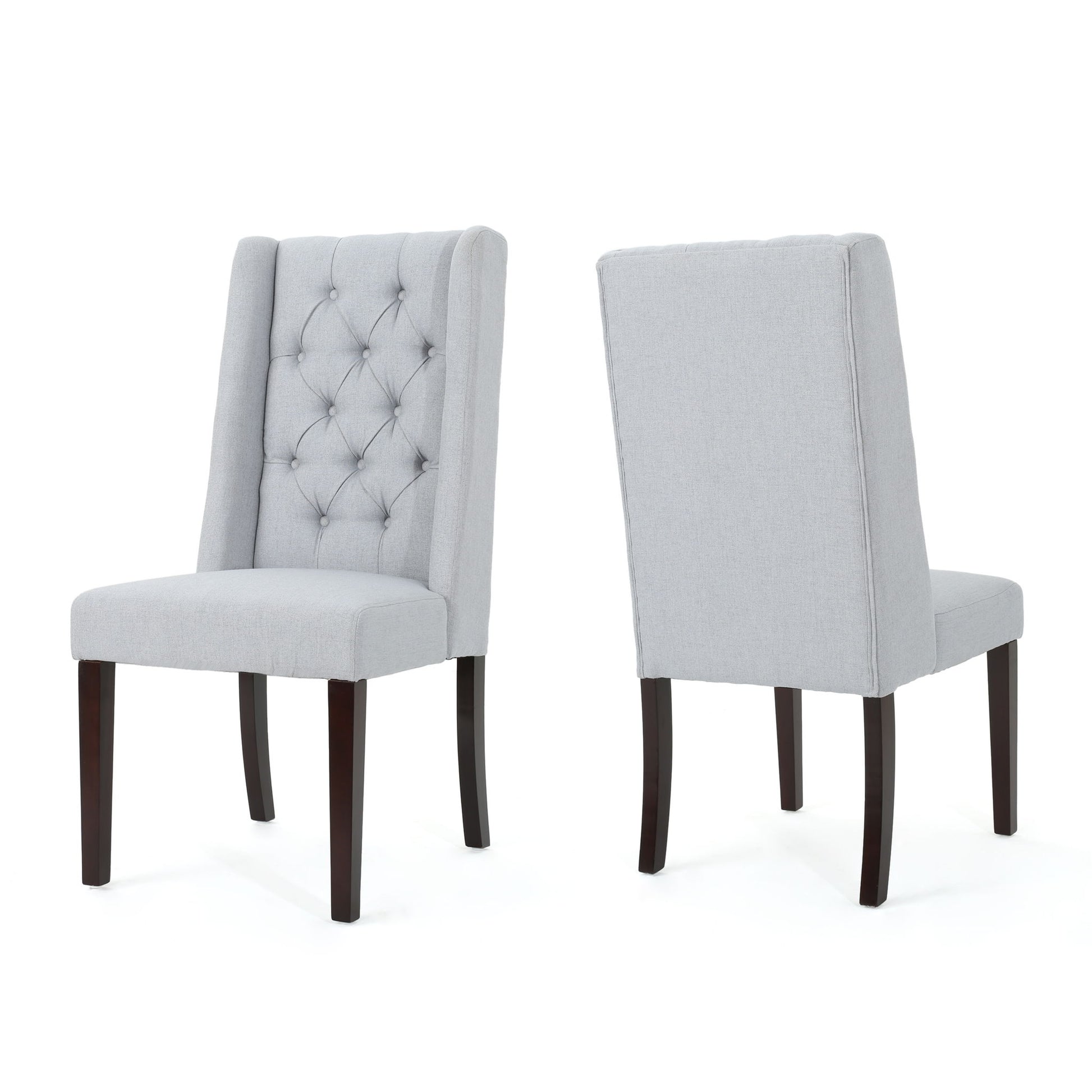 Pair of Sophisticated Tufted Dining Chairs With High Back Design in light gray upholstery and dark wooden legs; one displays its tufted button front, the other shows the smooth plain backrest.