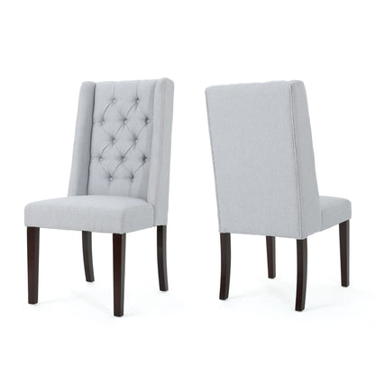 Pair of Sophisticated Tufted Dining Chairs With High Back Design in light gray upholstery and dark wooden legs; one displays its tufted button front, the other shows the smooth plain backrest.