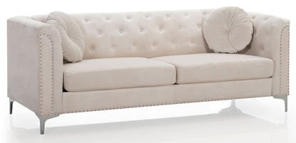 The Elegant Contemporary Sofa features a beige tufted design with silver stud accents, two seat cushions, two round matching throw pillows, and stands on sleek metallic legs against a white background.