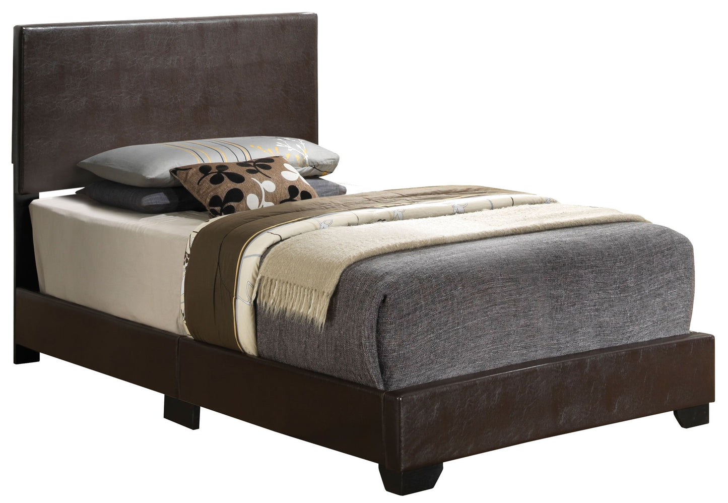 The Elegant Platform Bed For Relaxed Spaces features a dark brown leather frame, grey bedding, a beige blanket, and several decorative pillows in grey, beige, and patterned designs on top.