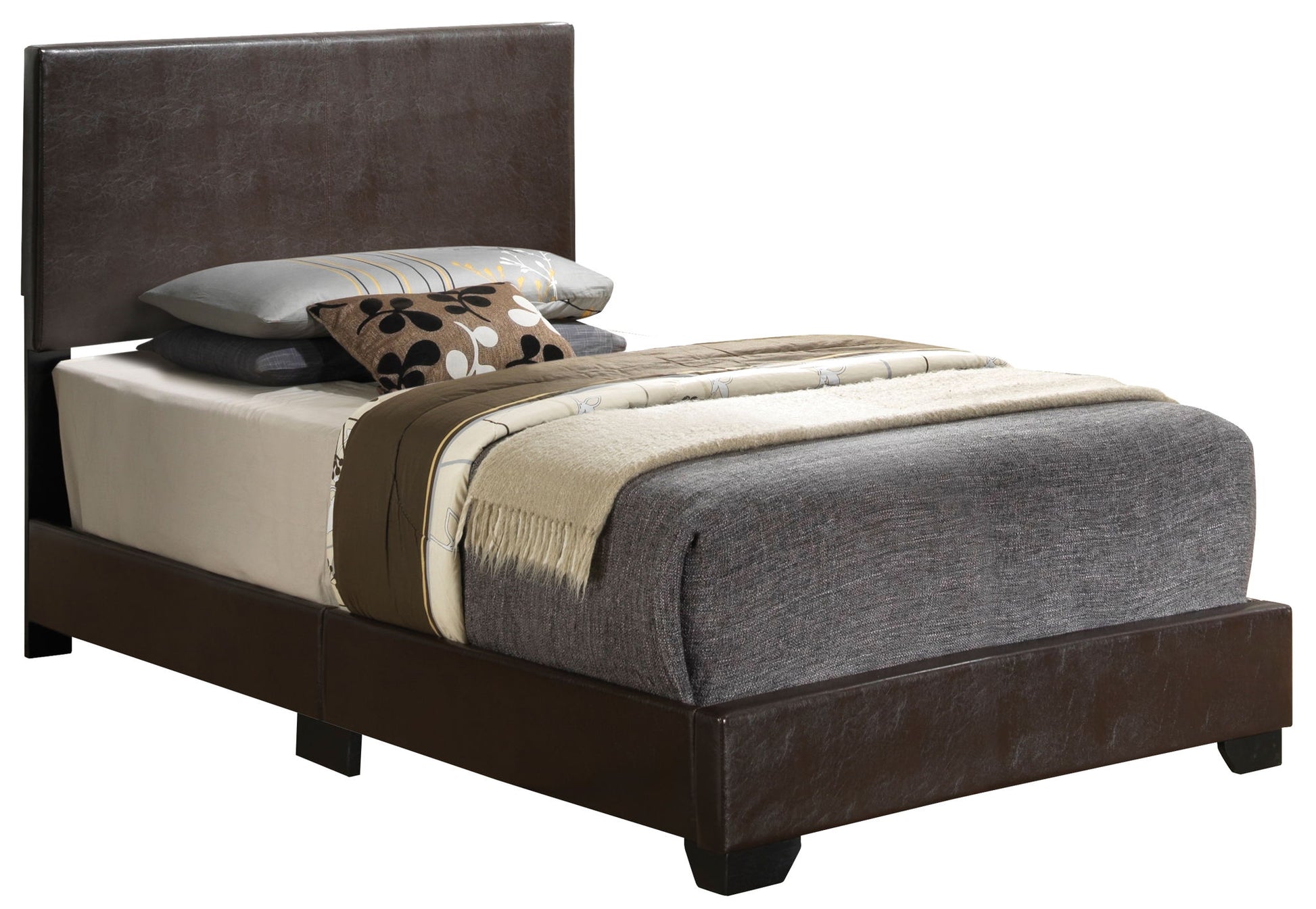 The Elegant Platform Bed For Relaxed Spaces features a dark brown leather frame, grey bedding, a beige blanket, and several decorative pillows in grey, beige, and patterned designs on top.