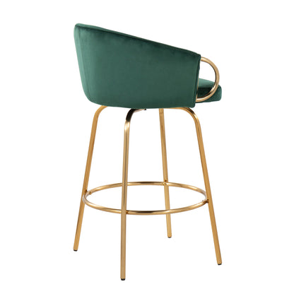 The Claire Contemporary & Glam Counter Stool (Set of 2) features a green upholstered seat, curved backrest, and gold metal legs with a circular footrest, showcased against a plain white background.
